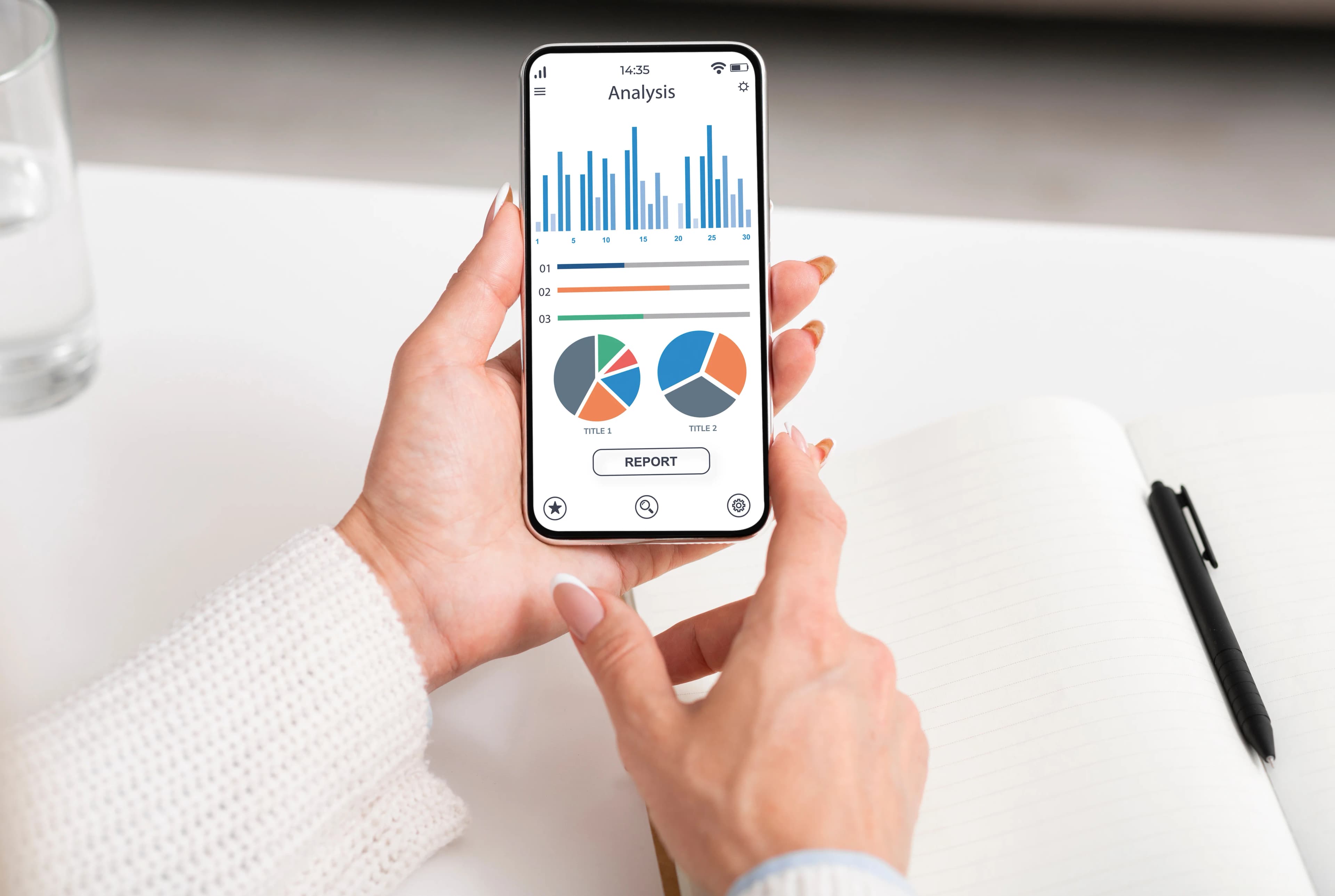 A person reviewing analytics charts on a smartphone