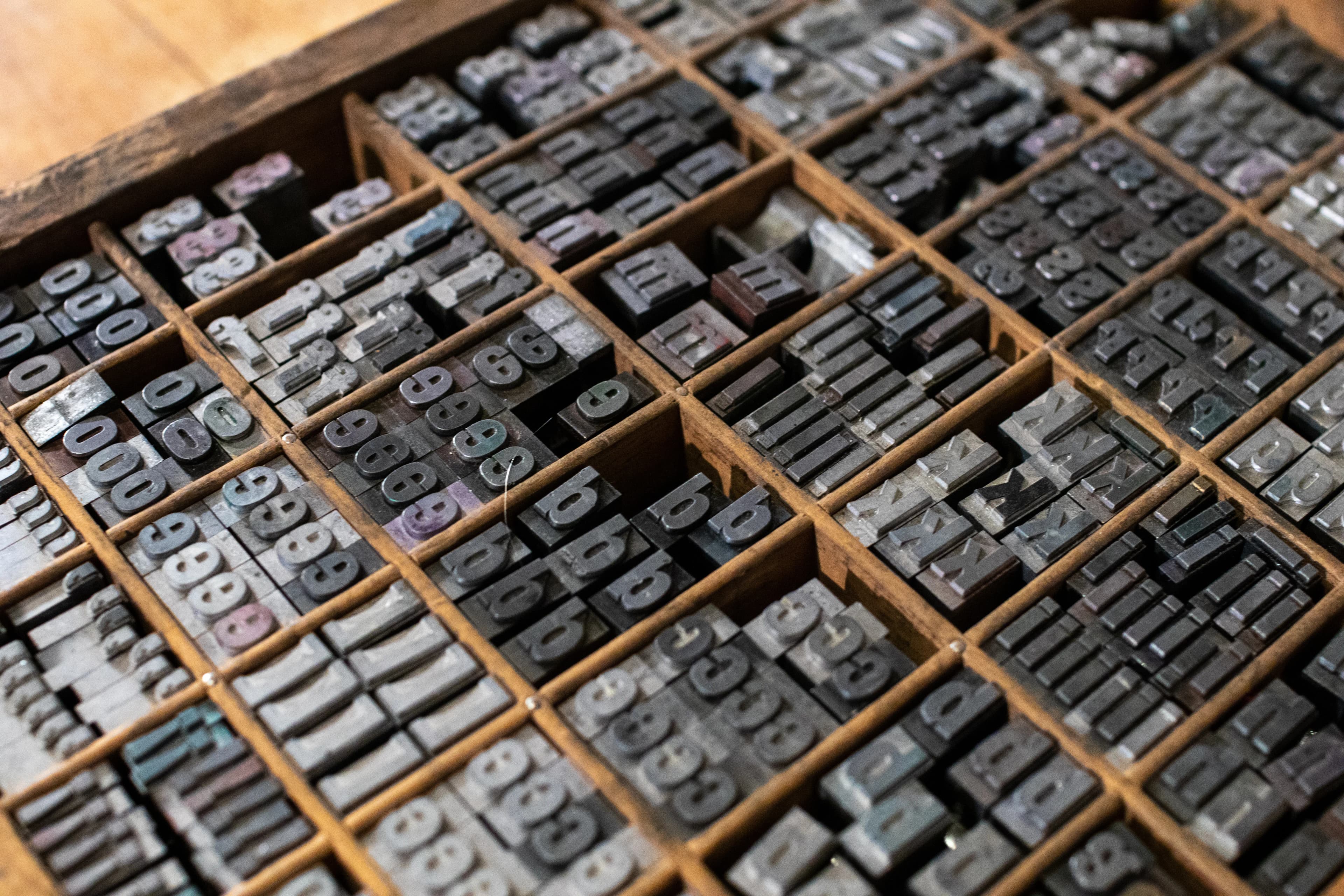 Metal type letters arranged in a letterpress type drawer